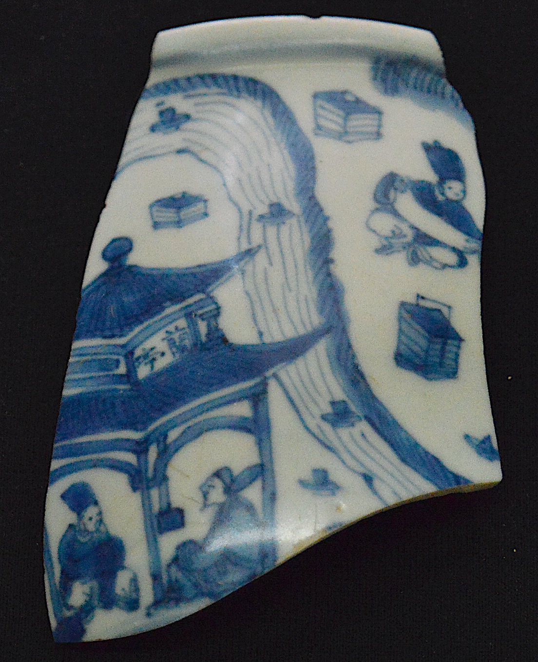 A blue-and-white shard featuring two people sitting under a pagoda at lower left.
