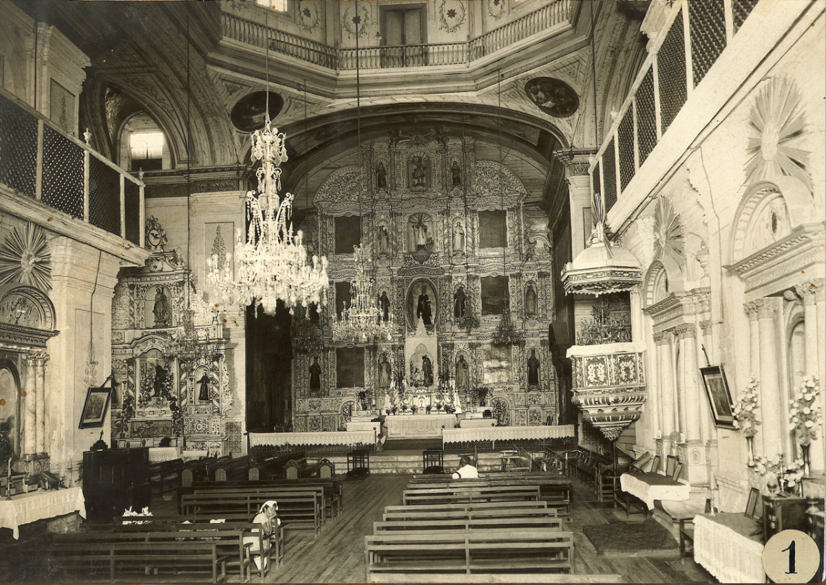 A black and white photograph of interior of a church.