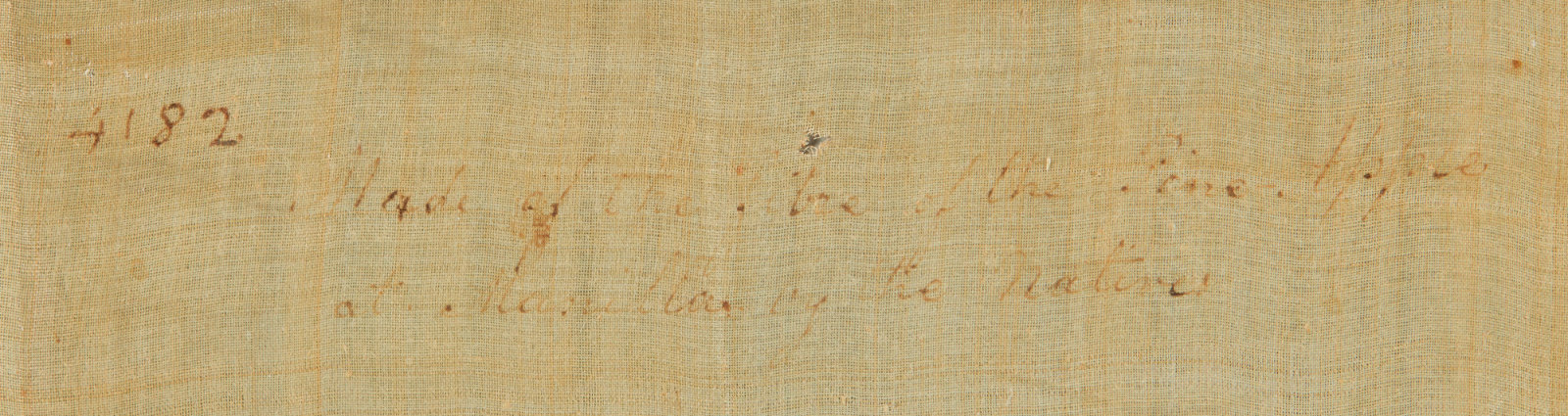 A photograph of a faint written inscription.
