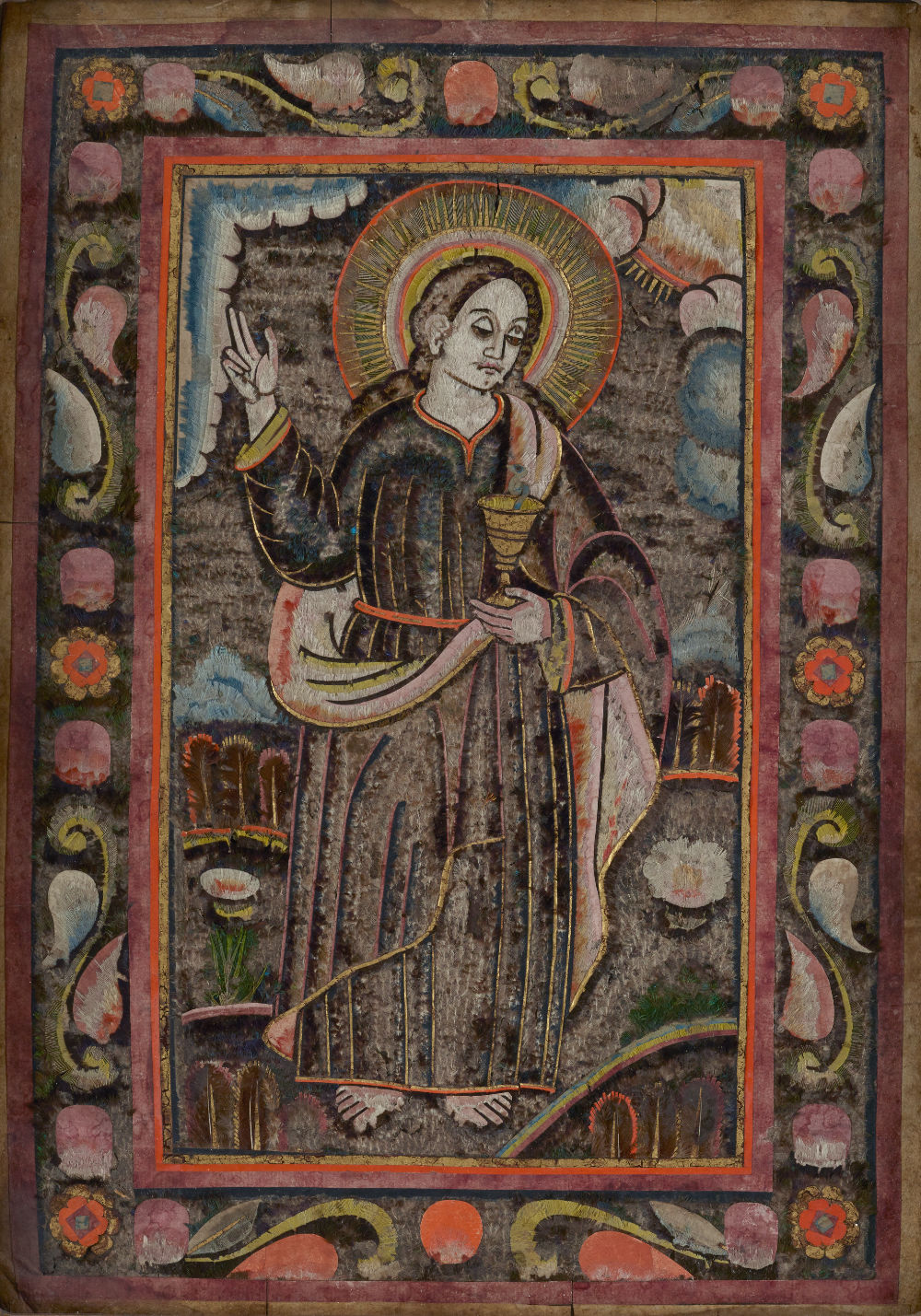 An image of St. John the Evangelist holding a chalice made from feathers.