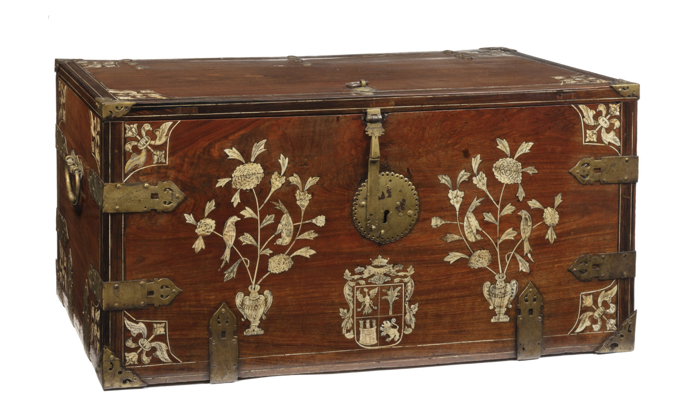 A wooden cabinet with inlaid floral imagery.