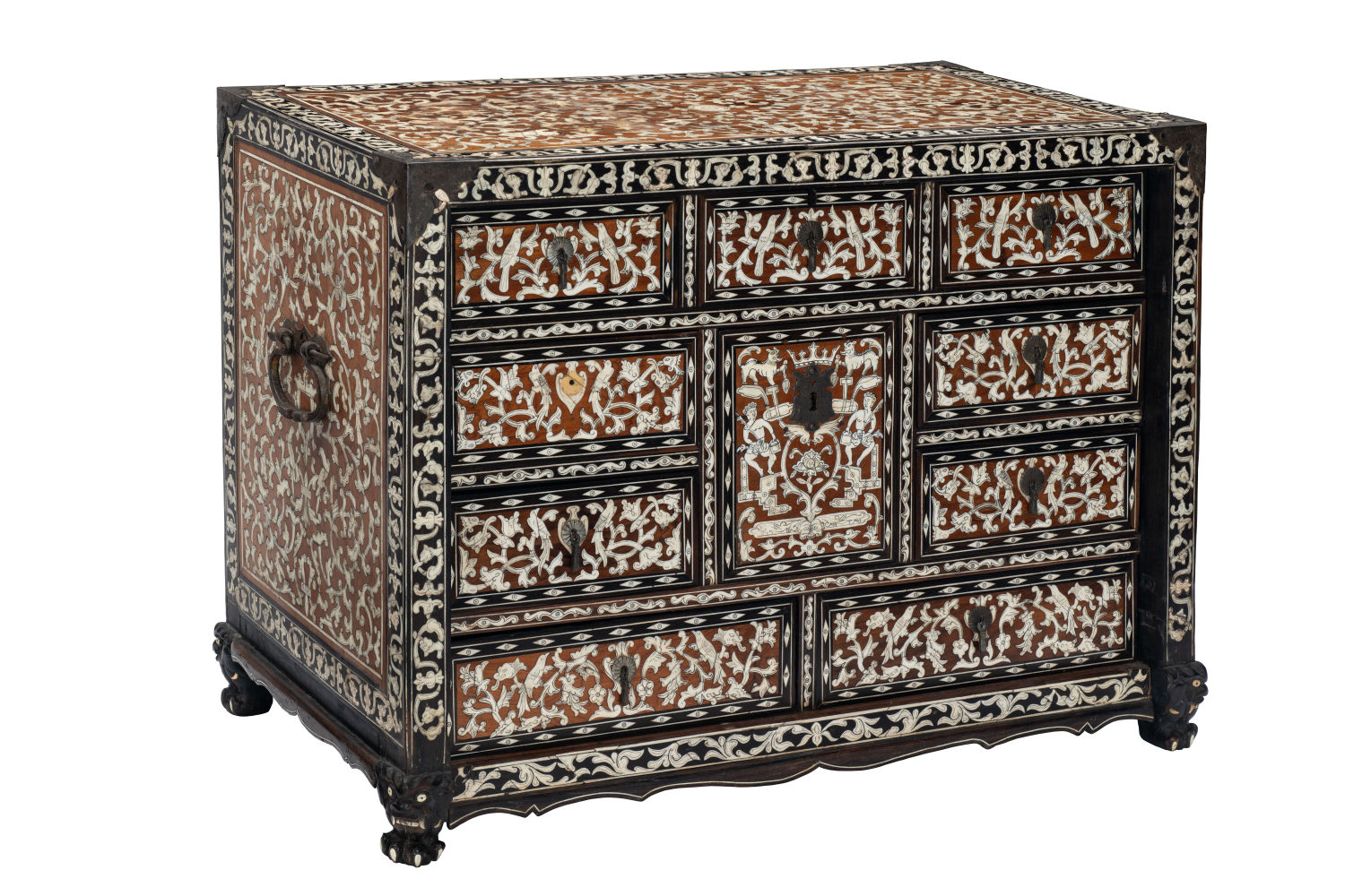 A cabinet heavily decorated with white floral motifs.